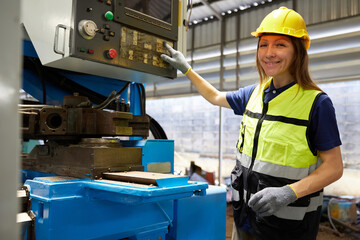 technician or engineer working and checking lathe machine in the factory