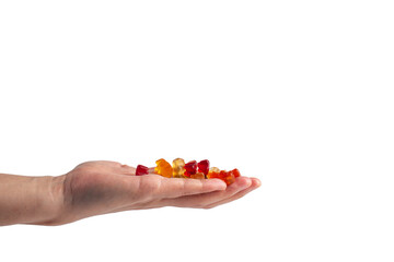 Hand and colorful Fruity Gummy Worm Candy on transparent background.