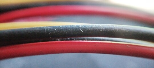 Close up of multicolored electric cable. Macro shot of electrical cable.