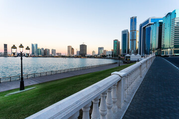 Naklejka premium Beautiful view of the Sharjah waterfront at sunset, UAE. Travel vacation in the United Arab Emirates .