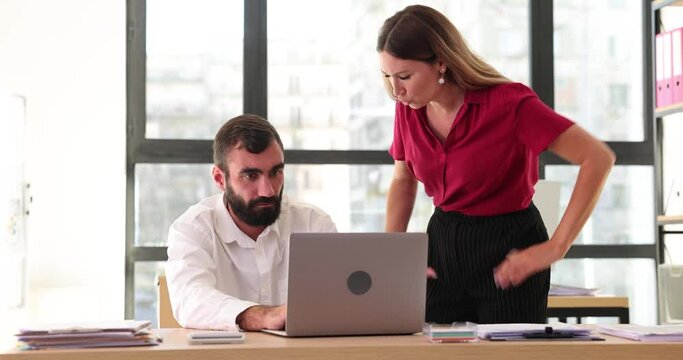 Angry woman manager yells at employees and kicks them out of workplace