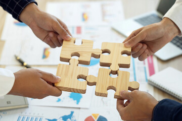 Concept of teamwork and partnership. Business teamwork puts the jigsaws team together cooperation unity concept represents team support and help. Charity, volunteer. Unity, team business. - obrazy, fototapety, plakaty