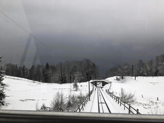 Railway track through the forest in winter