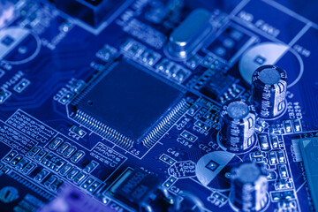 electronic components and microchips on computer circuit board. extreme closeup.