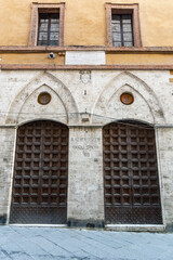 Fototapeta na wymiar Entrance of Università di Siena - Palazzo del Rettorato in Siena, Tuscany, Italy