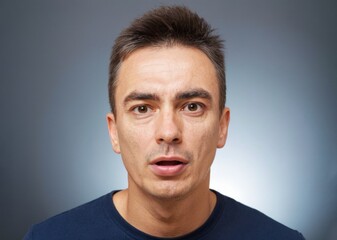 Obraz premium Portrait of shocked young man