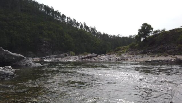 Silver River Water Flow Landscape around Dark Green Sierras in Indigenous Land, Calamuchita Valley in C&radic;&ge;rdoba Argentina
