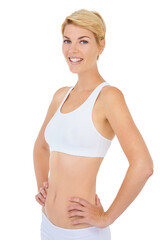 Fototapeta premium Woman, portrait and fitness with smile for workout, happy in sportswear for health and wellness on white background. Training, sports and athlete ready for gym and physical activity in studio