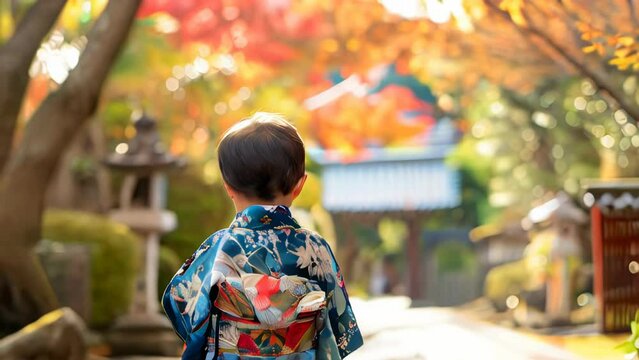 Japanese girl wearing a kimono walking in the autumn garden.
