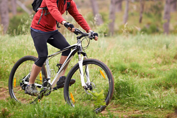 Bike, wheels and person cycling in countryside for fitness, health or off road trail hobby outdoor....