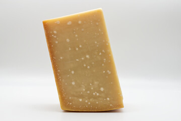 Italian Parmigiano Reggiano cheese isolated on white background. Parmesan cheese.