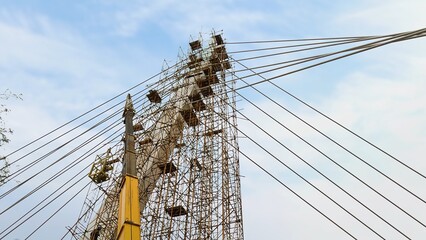 Construction of a cable-stayed bridge with a crane and scaffolding