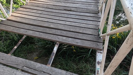 The destroyed wooden bridge over the river