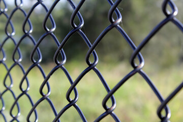 Close up view of a black chain link fence