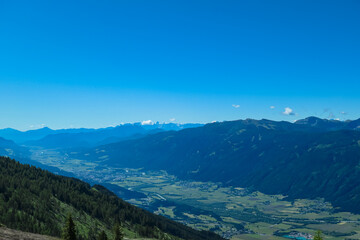 Panoramic view of majestic mountain peaks of Karawanks and Julian Alps seen from Boese Nase in...