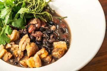 Tasty Colombian dish beans with bacon. Hotel restaurant food. Exquisite Colombian food.