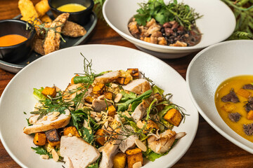 Starter, soup, salad and main course. Hotel meal. Delicious restaurant dishes. Several options.