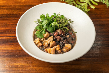 Tasty Colombian dish beans with bacon. Hotel restaurant food. Exquisite Colombian food.
