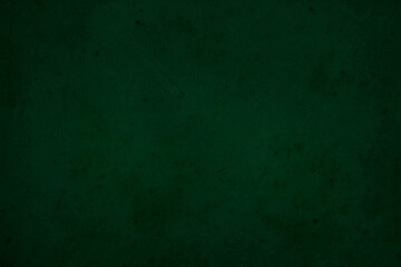 Green chalkboard texture for school display backdrop. chalk traces erased with copy space for add text or graphic design grunge background. Green board. Dark green wall backdrop. Education concepts.