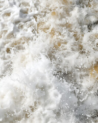 Close up of white water splashing in the river. Abstract background.