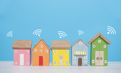Miniature house with Wifi signal. The concept of network connect, internet of things, smart home...