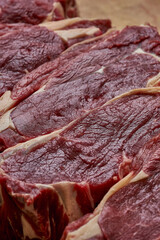 A fresh piece of beef steak on a cutting board