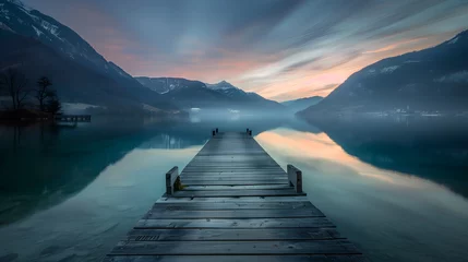 Photo sur Plexiglas Descente vers la plage lake in mountains at sunset with wooden jetty.