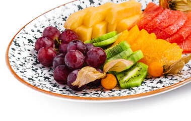 different tropical fruits on a plate