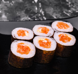 Salmon Maki Sushi on Black Stone Plate