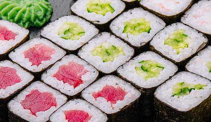 Maki sushi set served on black stone tray