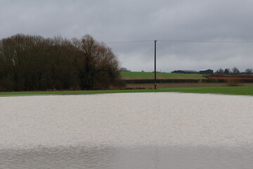 Flood water in country lane  