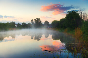 Beautiful summer landscape at sunrise. Morning fog over the river. - obrazy, fototapety, plakaty