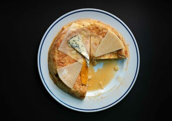 Overhead shot of Spanish omelette with cheeses, Spanish omelette little cast