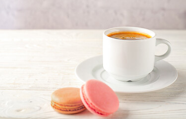 White cup of black coffee isolated on white background