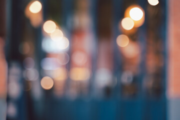 Abstract blurred image of cafe or restaurant with bokeh lights background at night.