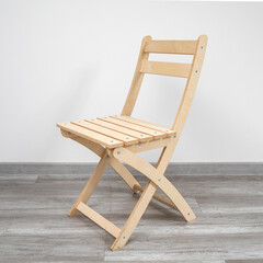 Folding wooden chair for a veranda
