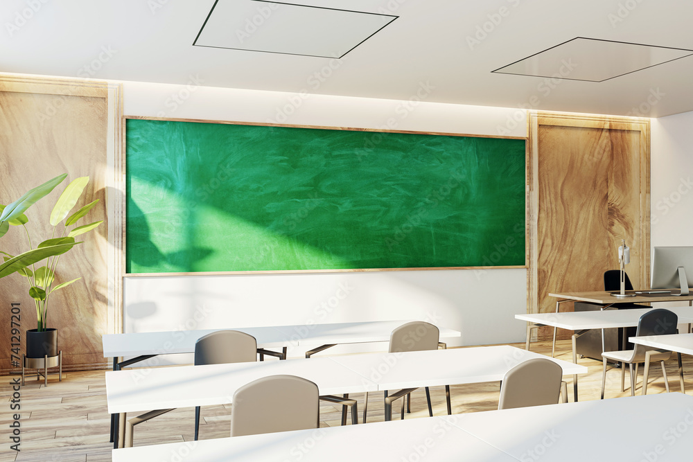 Poster Modern classroom interior with a green chalkboard and sunlight filtering through windows. 3D Rendering
