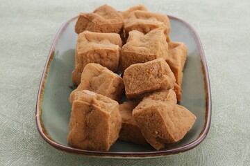 sumedang tofu on a rustic green plate