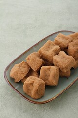 sumedang tofu on a rustic green plate