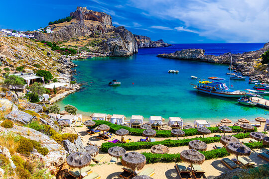 Lindos city on Rhodes island, Greece. St Paul's Bay Beach and the Acropolis, on Rhodos Island, Greece at Aegean Sea