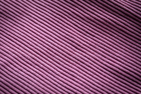 Purple knit with seam, ribbed, distinct texture, curved fabric
