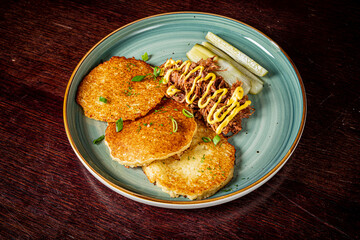 potato pancakes with meat and cucumber
