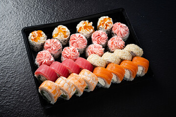 tasty sushi on the black background