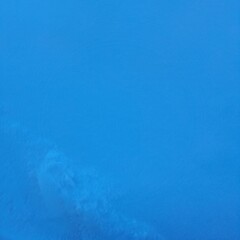 blue water surface. Toned  canvas  fabric. Veb  banner.  Long.  Panoramic. Color gradient. blue background texture blue dark black with dark blue blurred background with light