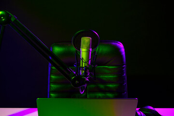 Home studio podcast interior. Microphone, table and chair