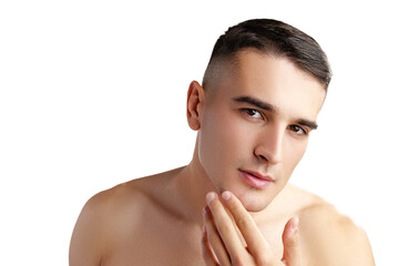 Young attractive brunet guy with perfect skin touching chin on white background