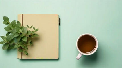 A school notebook rests on a green background, atop a table.