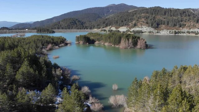 Aerial view Aoos spring lake islets Mountain Forest trees sunny day