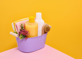 Purple basin with shower accessories. Skin and hair care.