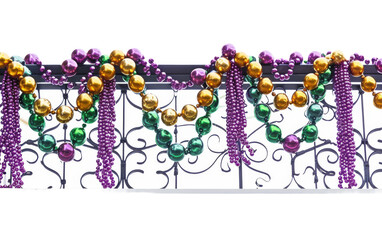 Mardi Gras Beads Adorn Balcony Railing On Transparent Background.